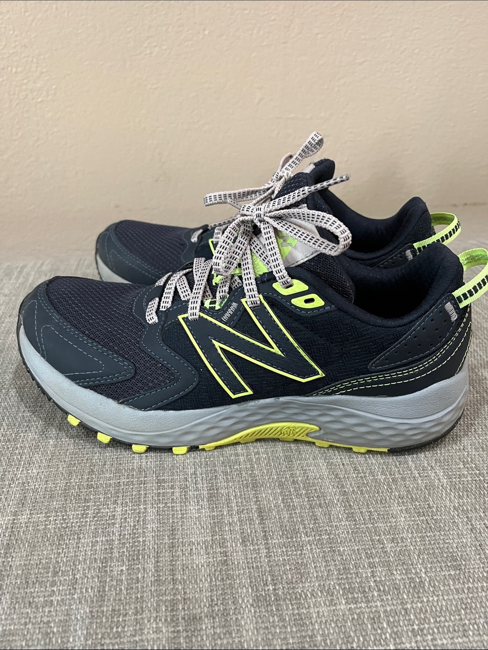 New Balance women’s Navy and Neon Yellow Athletic Sneakers